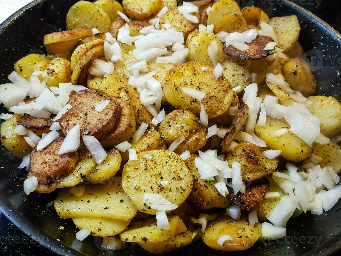 farmers breakfast roasted potatoes with ham and eggs photo