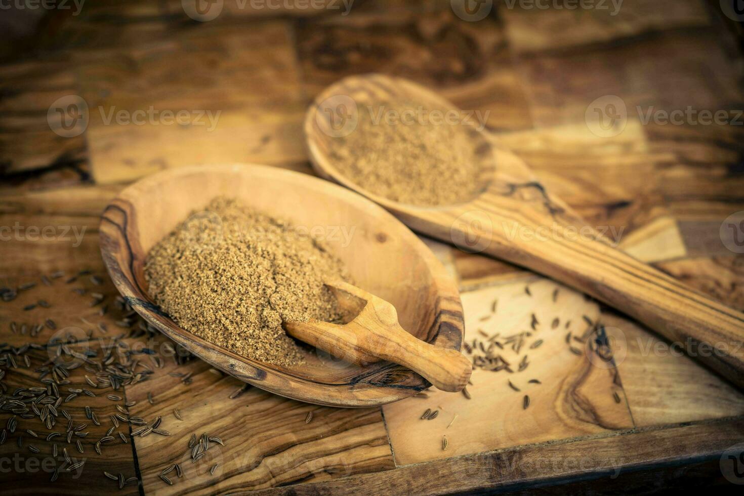 caraway seeds Carum carvi on olive wood photo