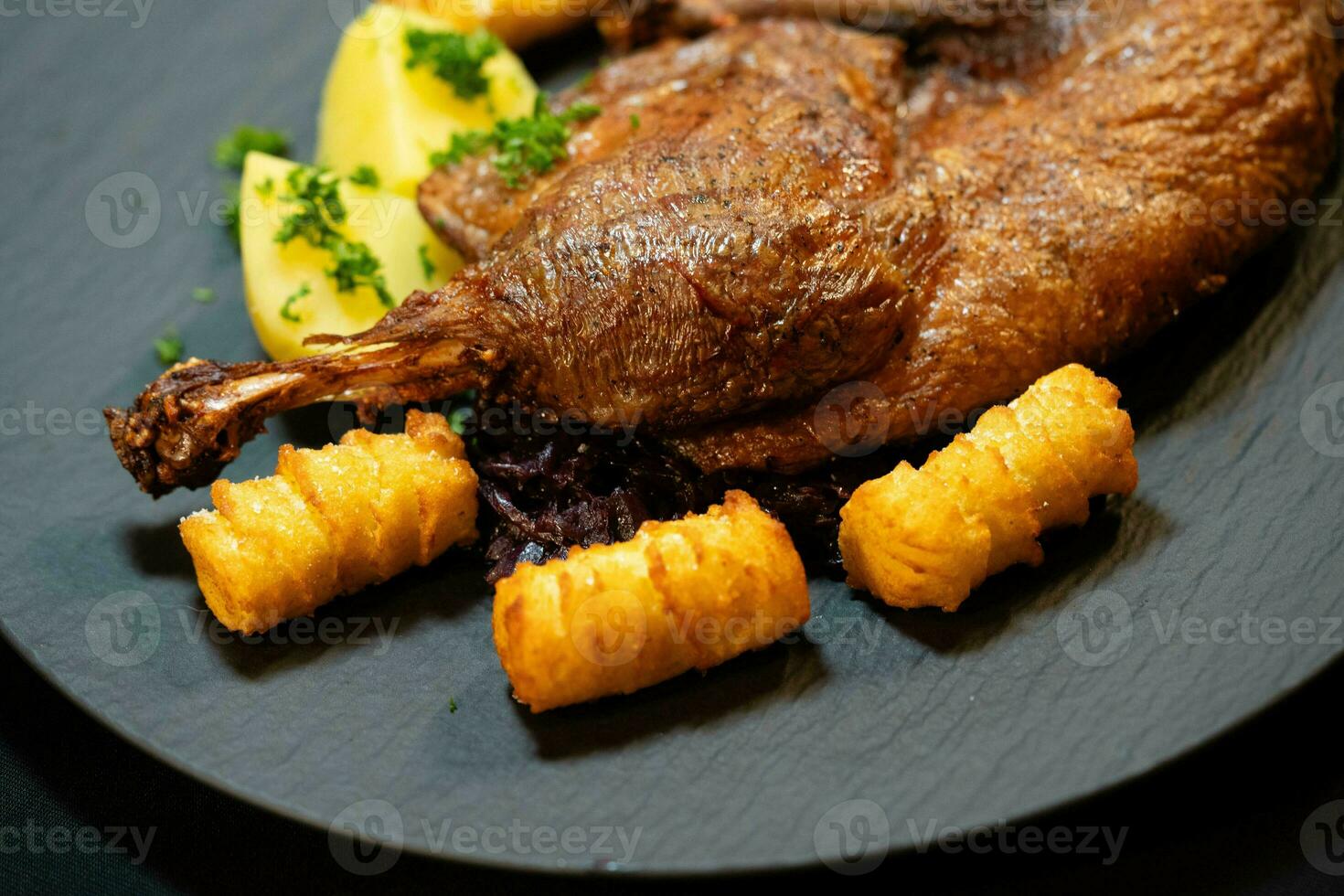 roasted duck with red  cabbage and potatoes photo