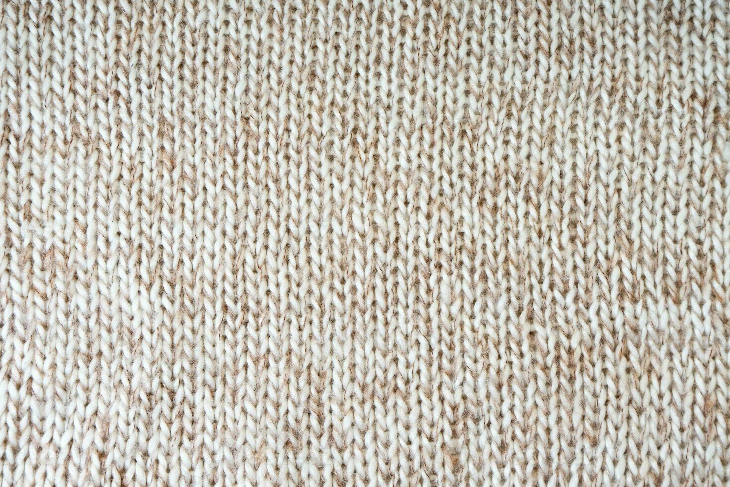 White biege melange knitting wool texture background. photo