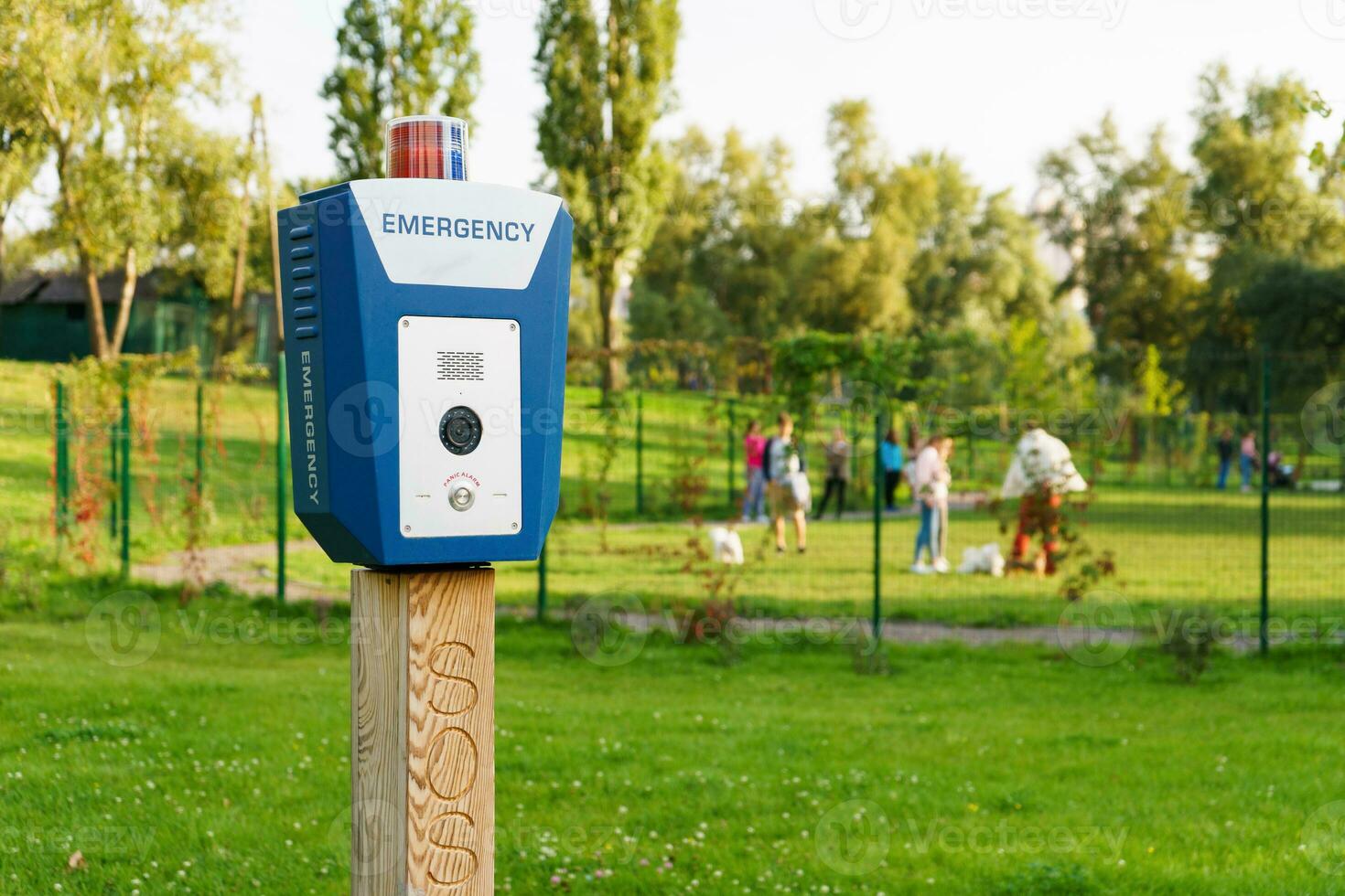 Panic alarm, police, emergency button in the public park. photo