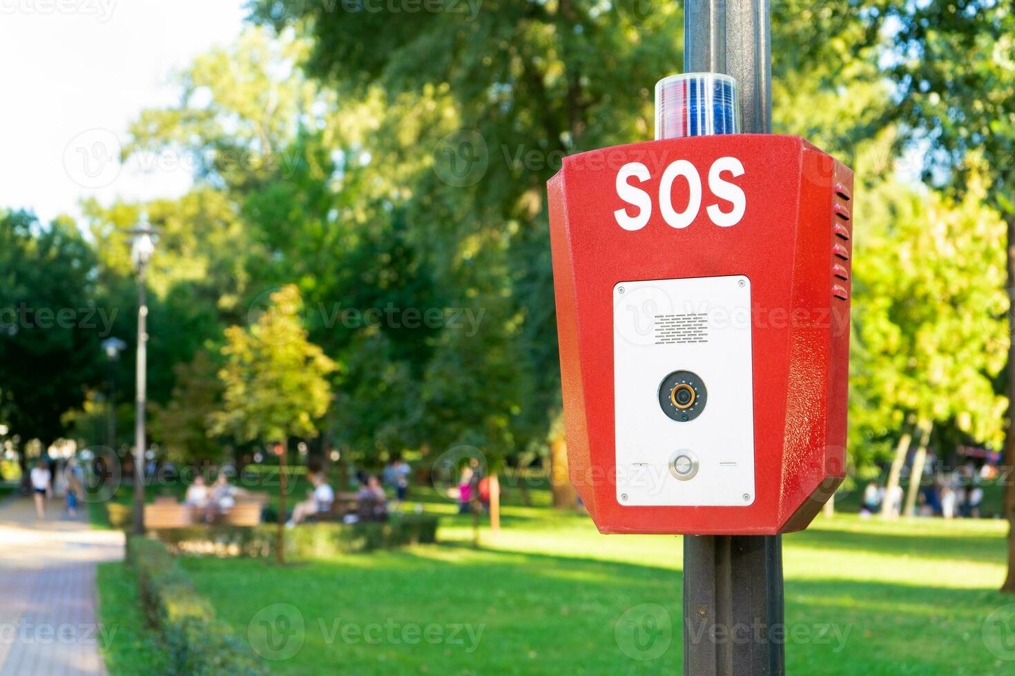 SOS, police, emergency button in the public park. photo