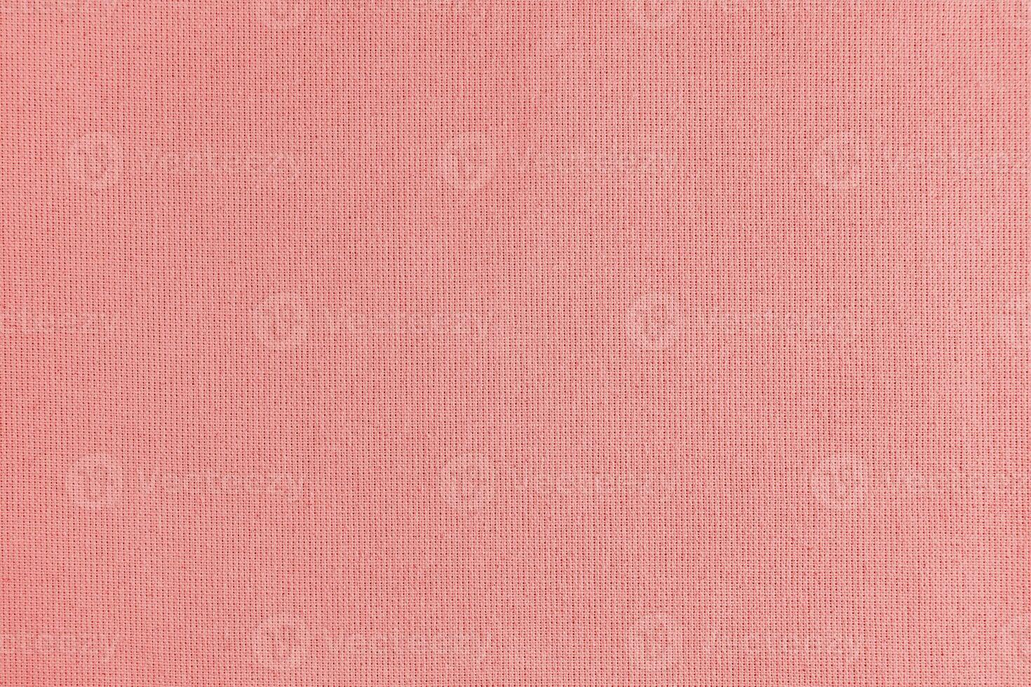 Texture background of red cotton fabric, cloth surface, weaving of linen fabric photo