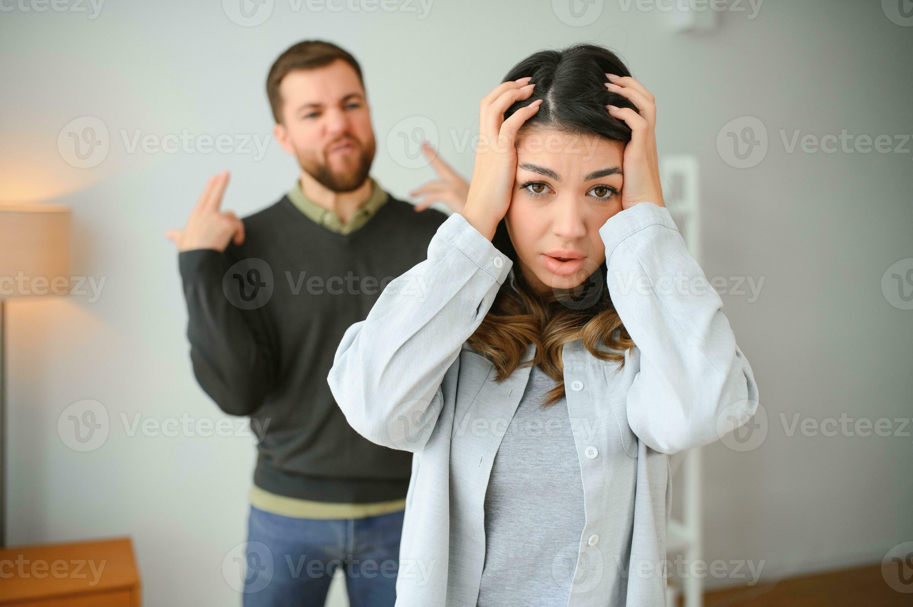 Irritated Husband Is Shouting At His Wife With Violence Woman Is Covering Her Face With Fear 