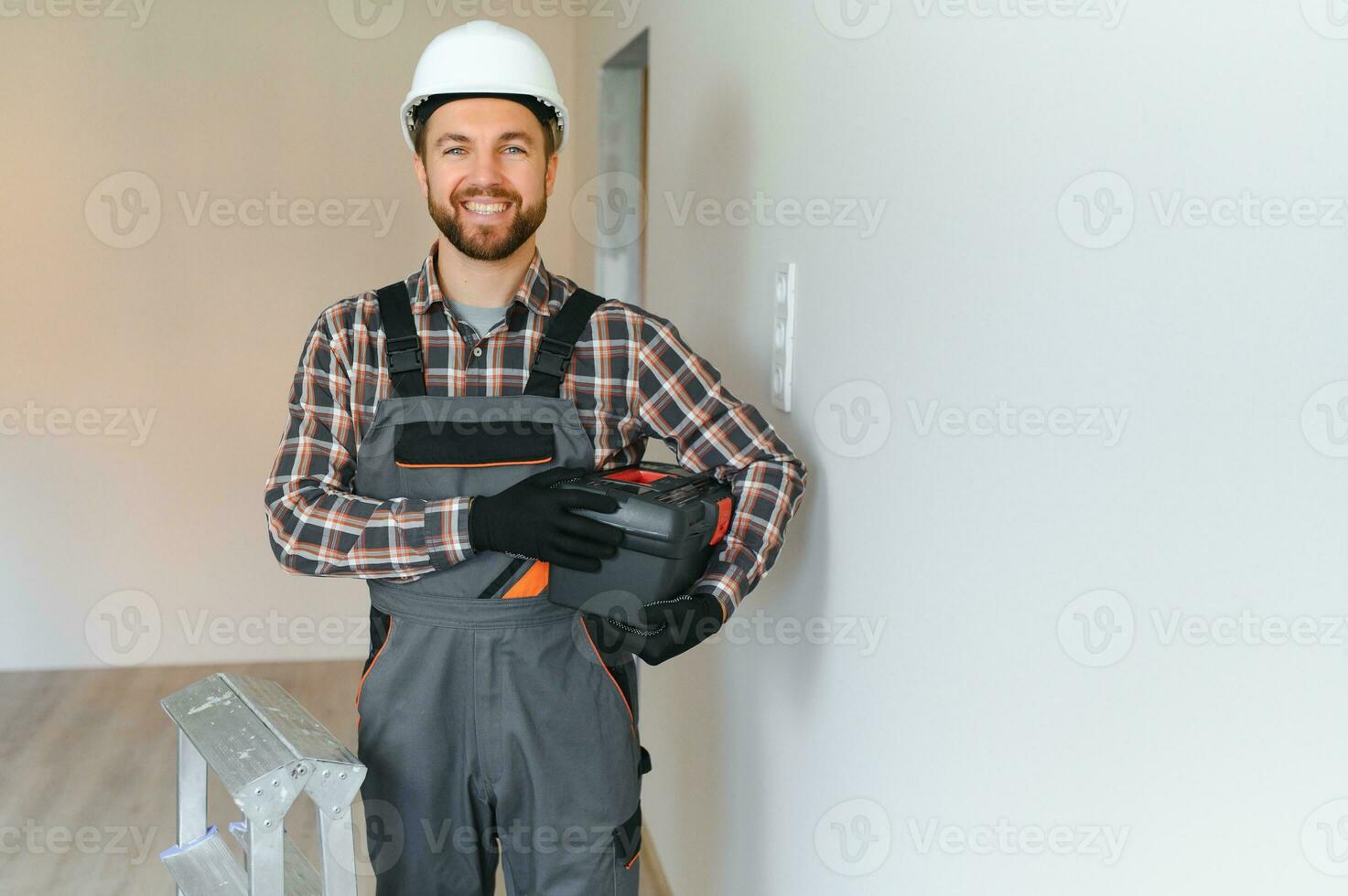 Portrait of male worker with toolbox photo