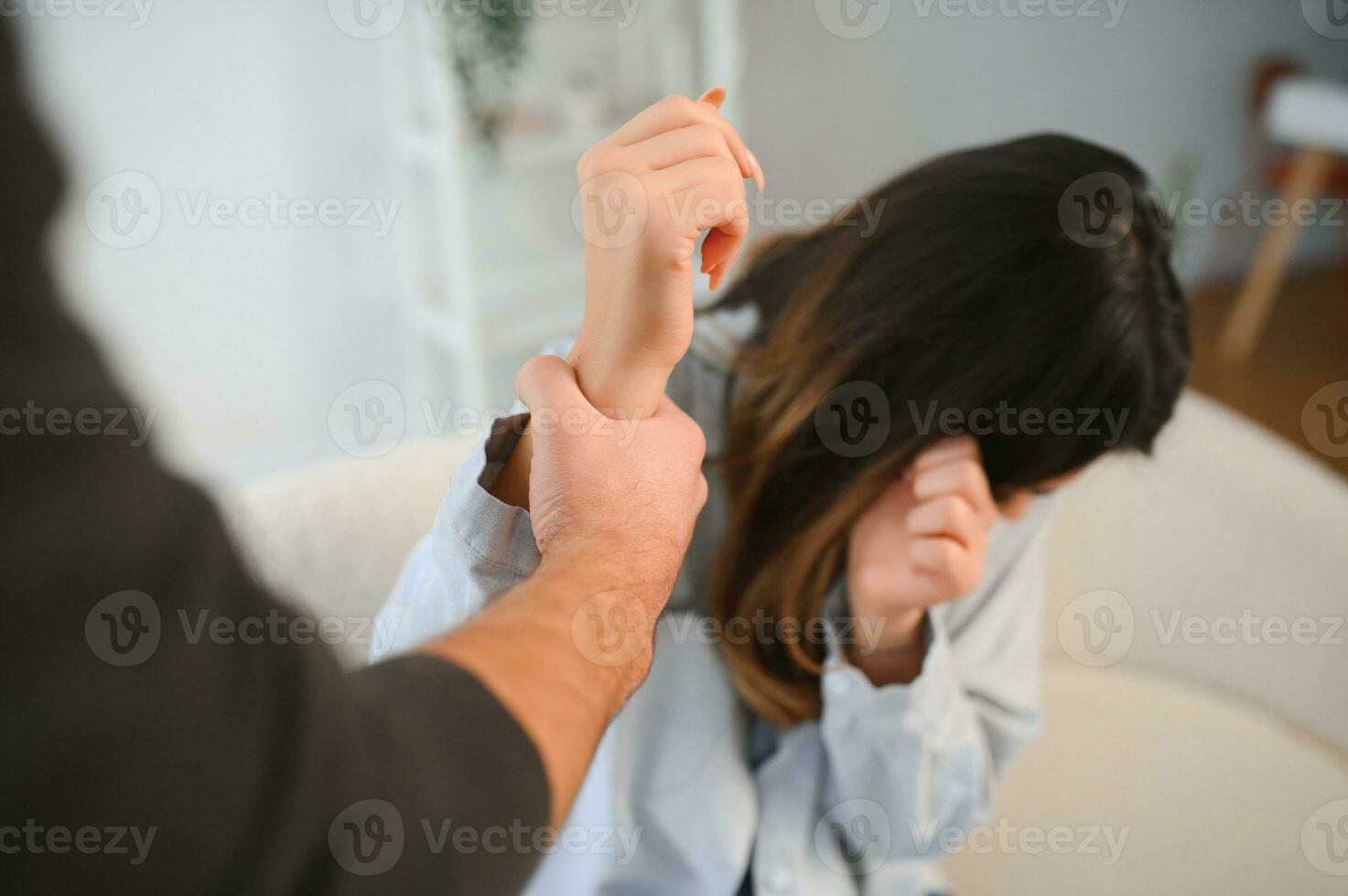 Angry husband beats his wife, domestic violence photo