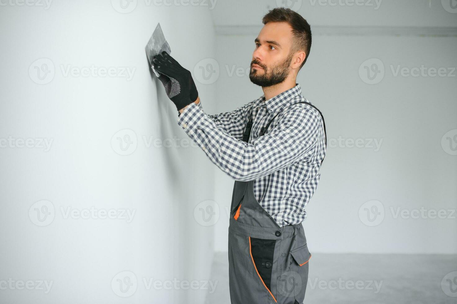 worker making repair in room. photo