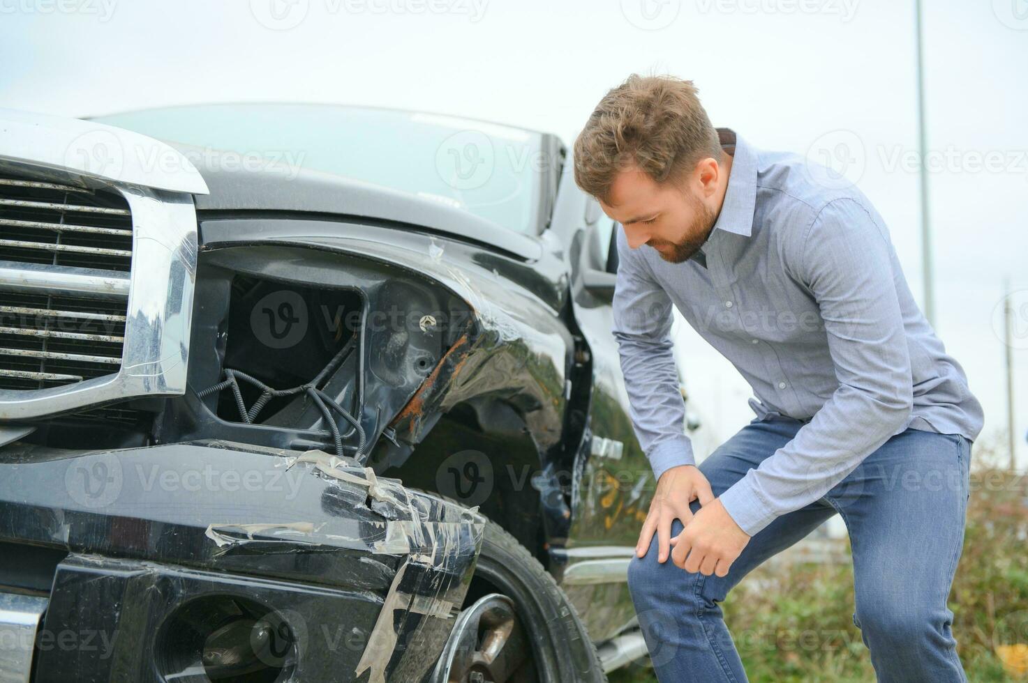 Car accident. Man after car accident. Man regrets damage caused during car wreck photo