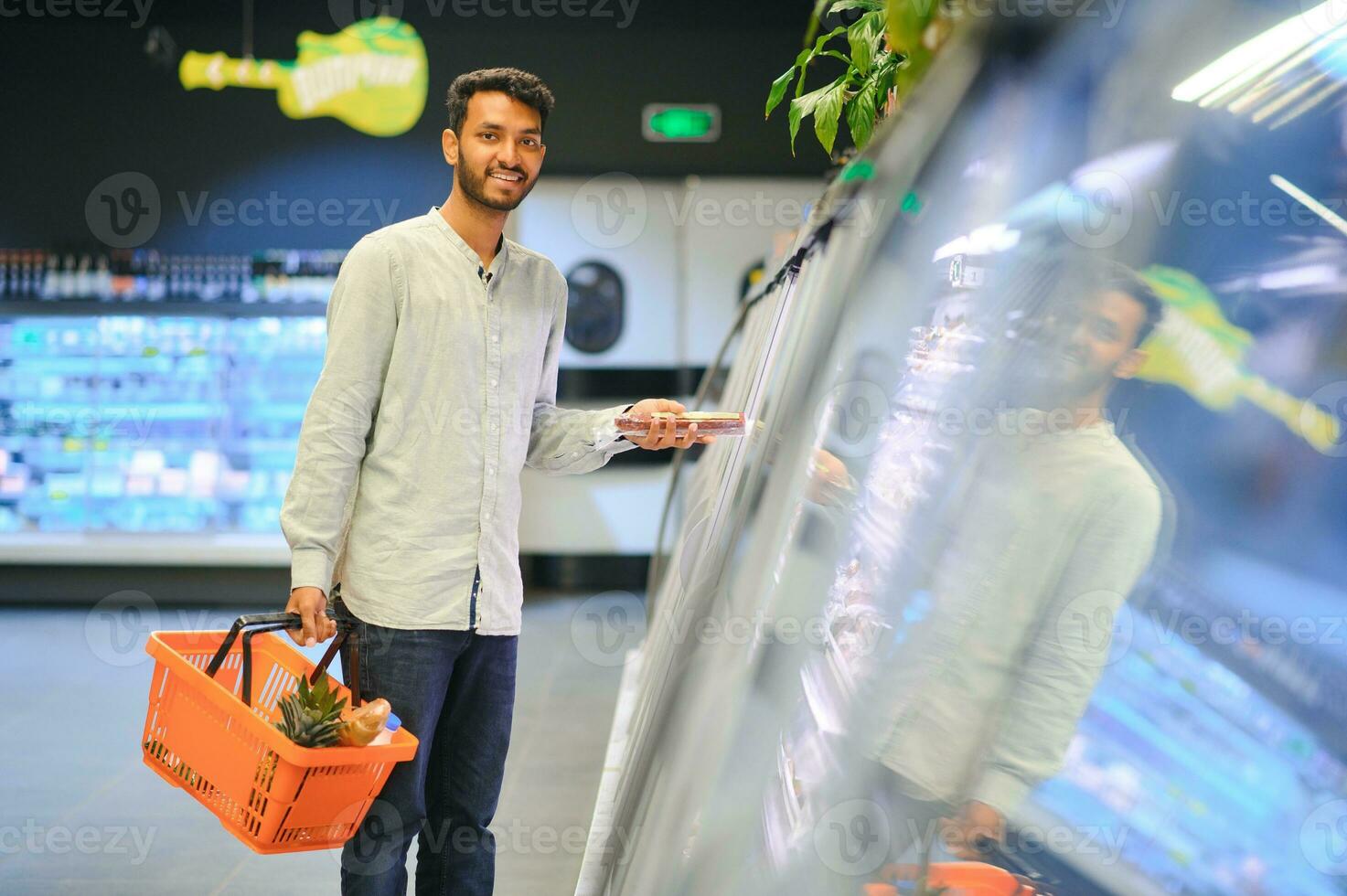 Man at grocery store products photo