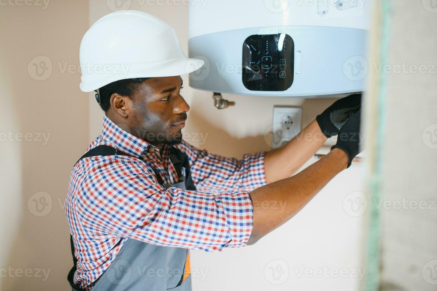 African american worker set up central gas heating boiler at home photo