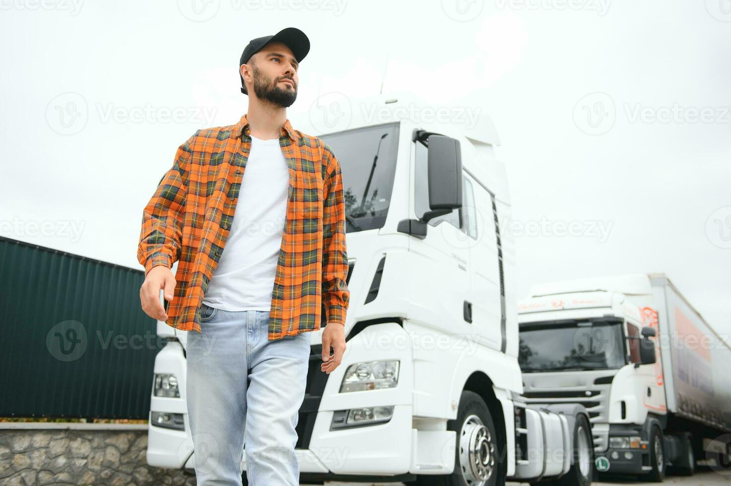 Men driver near lorry truck. Man owner truck driver near truck. Man trucker trucking owner. Transportation industry vehicles. Handsome man driver front of truck. photo