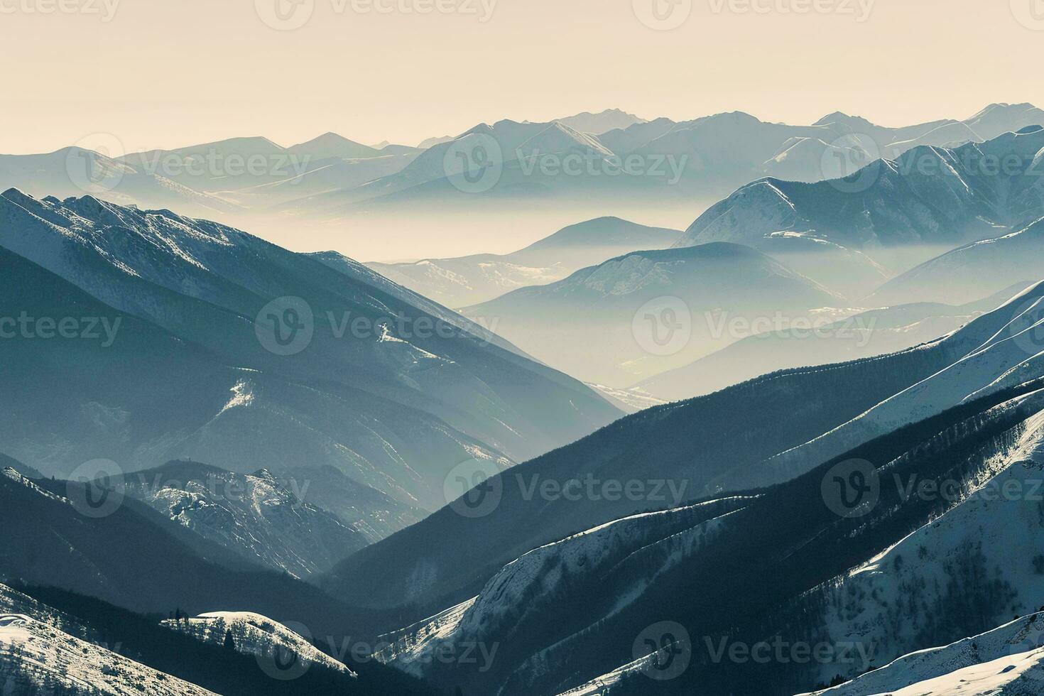AI generated Breathtaking view of snowy mountains, peaceful valleys with a touch of mist enhancing the tranquil scenery photo
