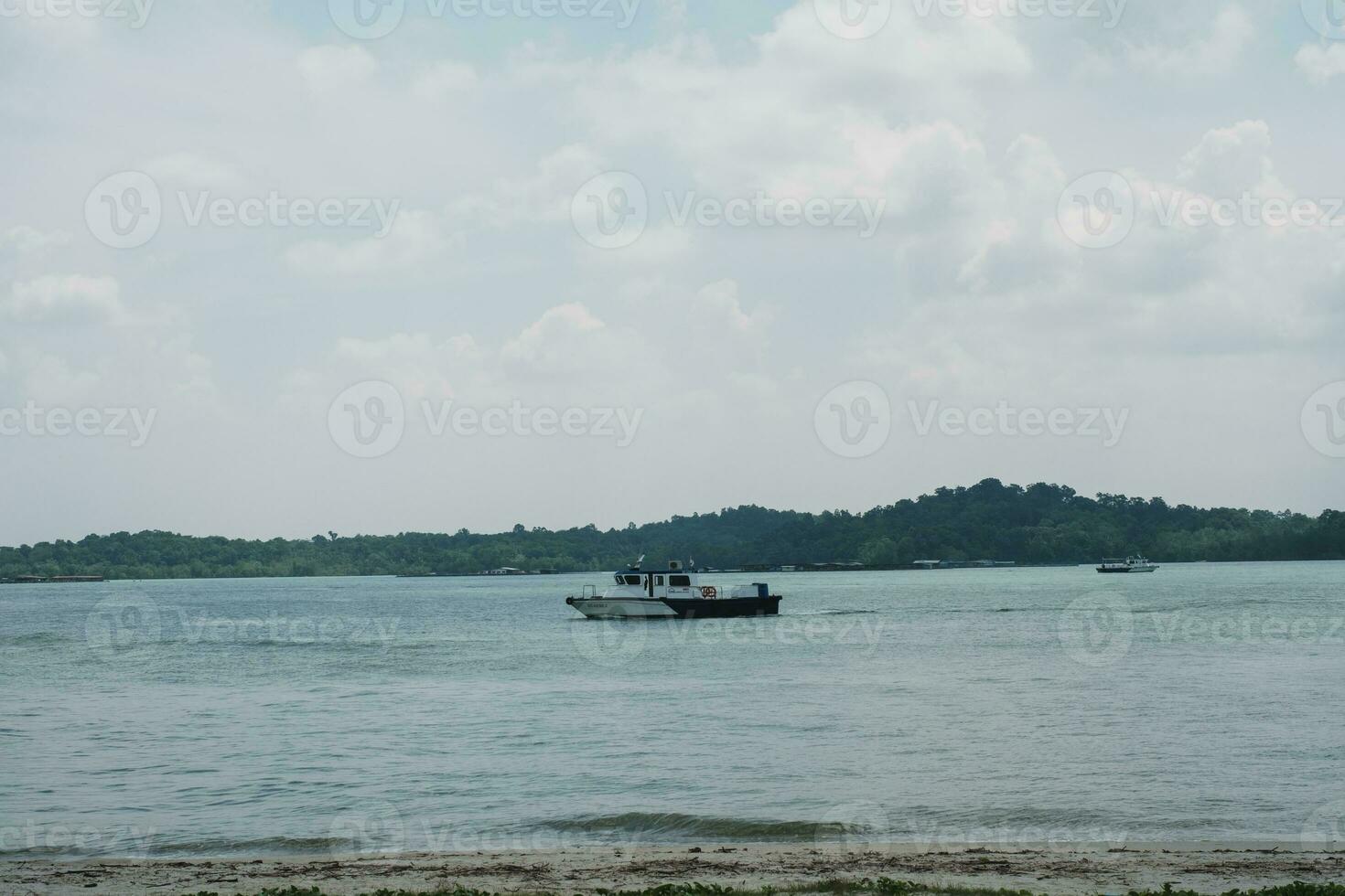 Boat on Coastal Beach Shore photo