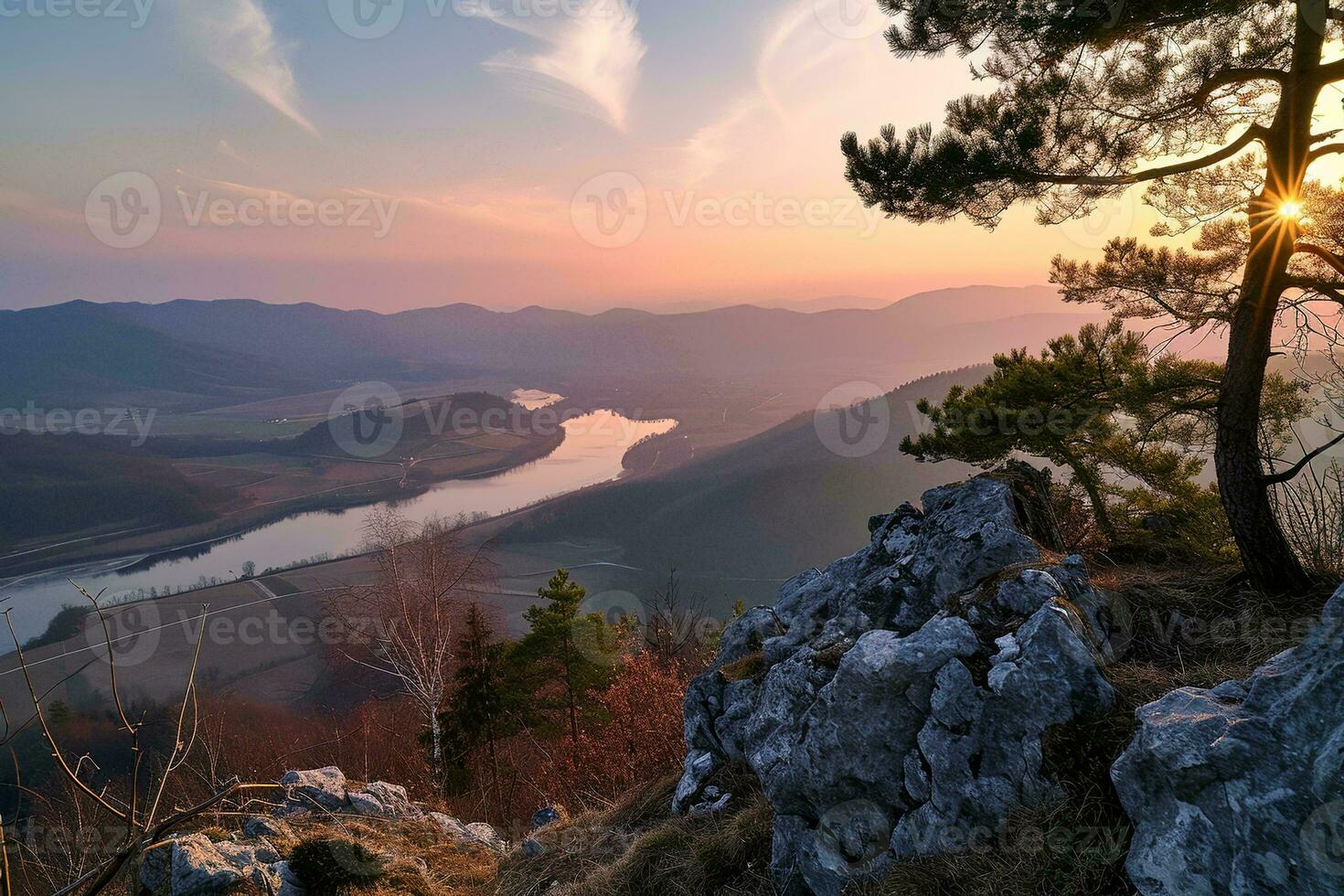 AI generated a breathtaking sunset over a tranquil river winding through lush mountains, captured from a rocky viewpoint adorned with pine trees. photo