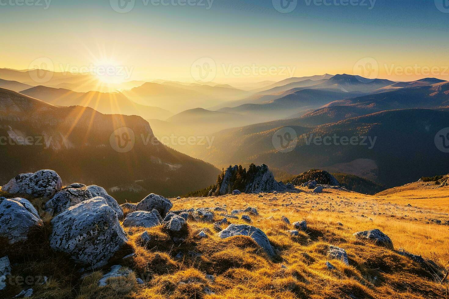 AI generated a golden sunrise casting light on a rocky, grassy landscape with distant mountains shrouded in mist. photo