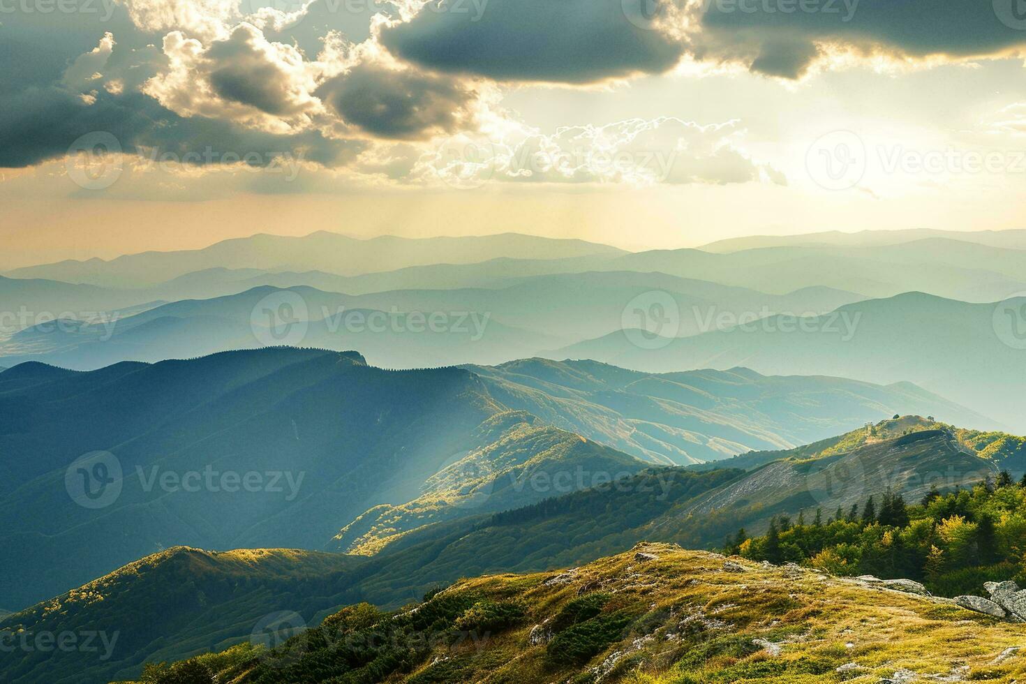 AI generated Breathtaking view of sunset illuminating green mountain ranges under a dramatic cloudy sky, showcasing nature's grandeur. photo