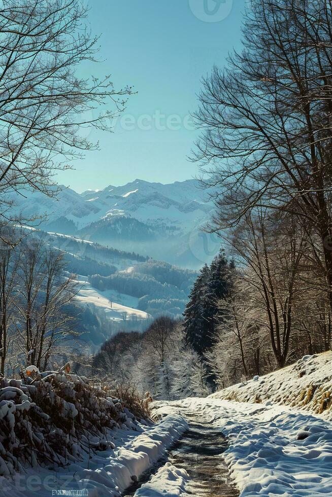AI generated A breathtaking snowy landscape featuring a winding path, bare trees, and majestic mountains under a clear blue sky. photo