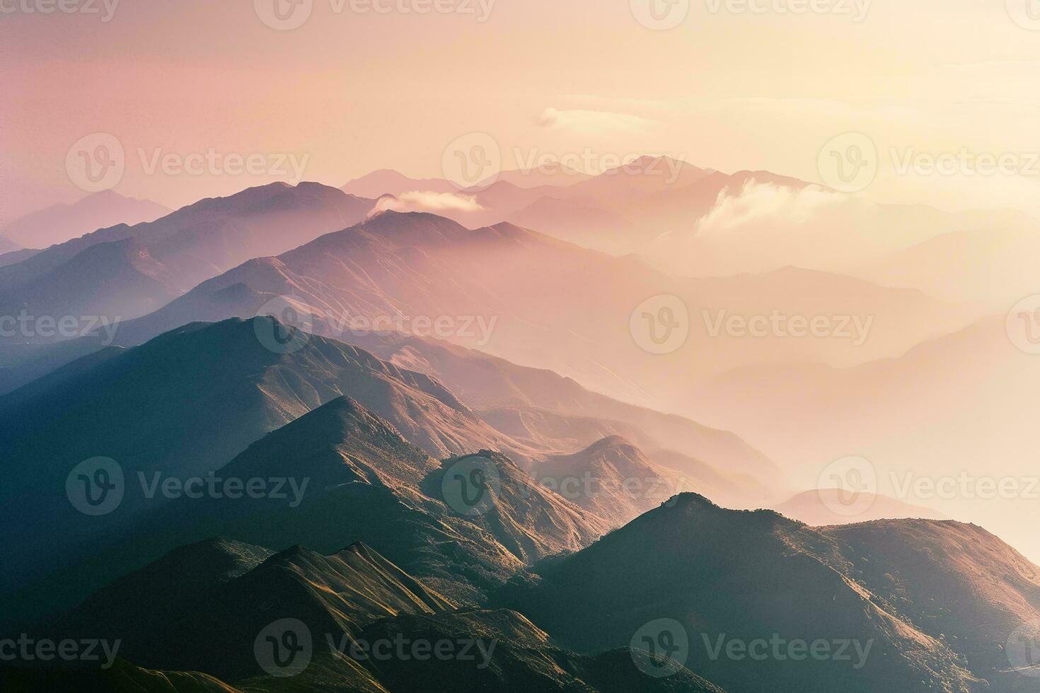 AI generated A breathtaking view of layered mountains bathed in the soft glow of sunset, showcasing a dance of light and shadow. photo