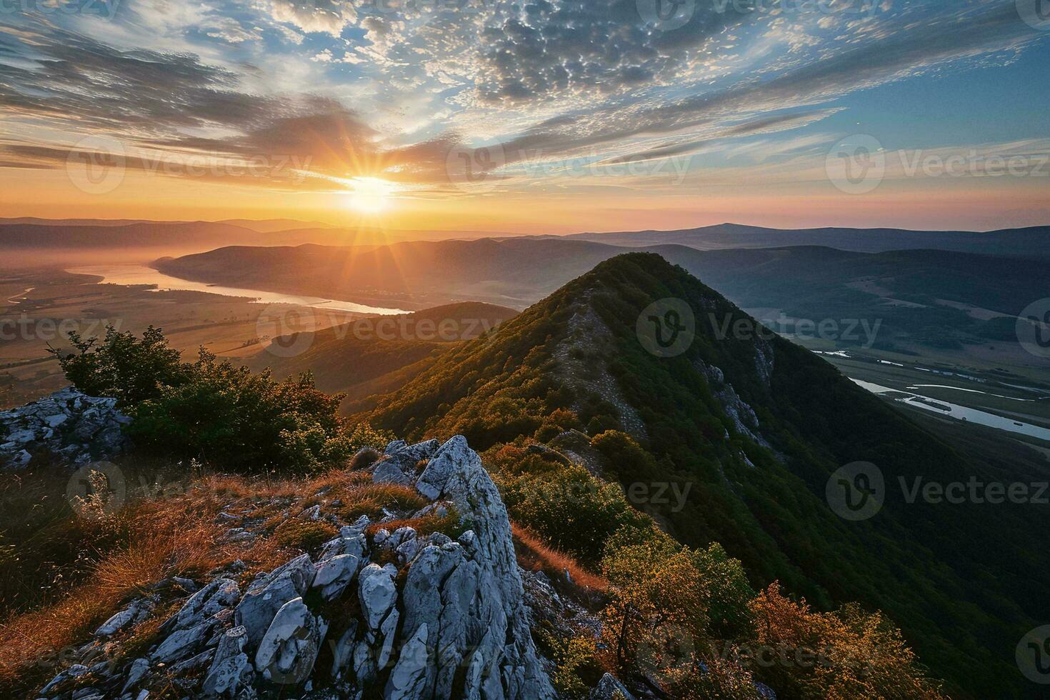 AI generated a stunning sunrise from a high vantage point atop rugged mountains. Golden sunlight illuminates the scene photo