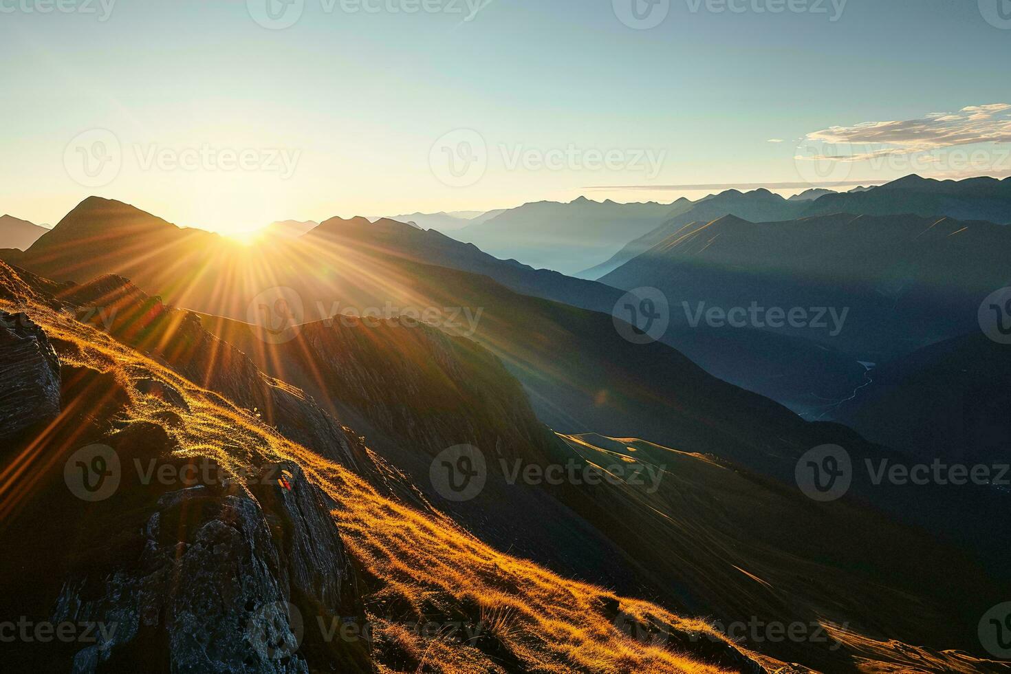AI generated A breathtaking sunrise casts golden light on mountain slopes, revealing a serene landscape of peaks and valleys photo