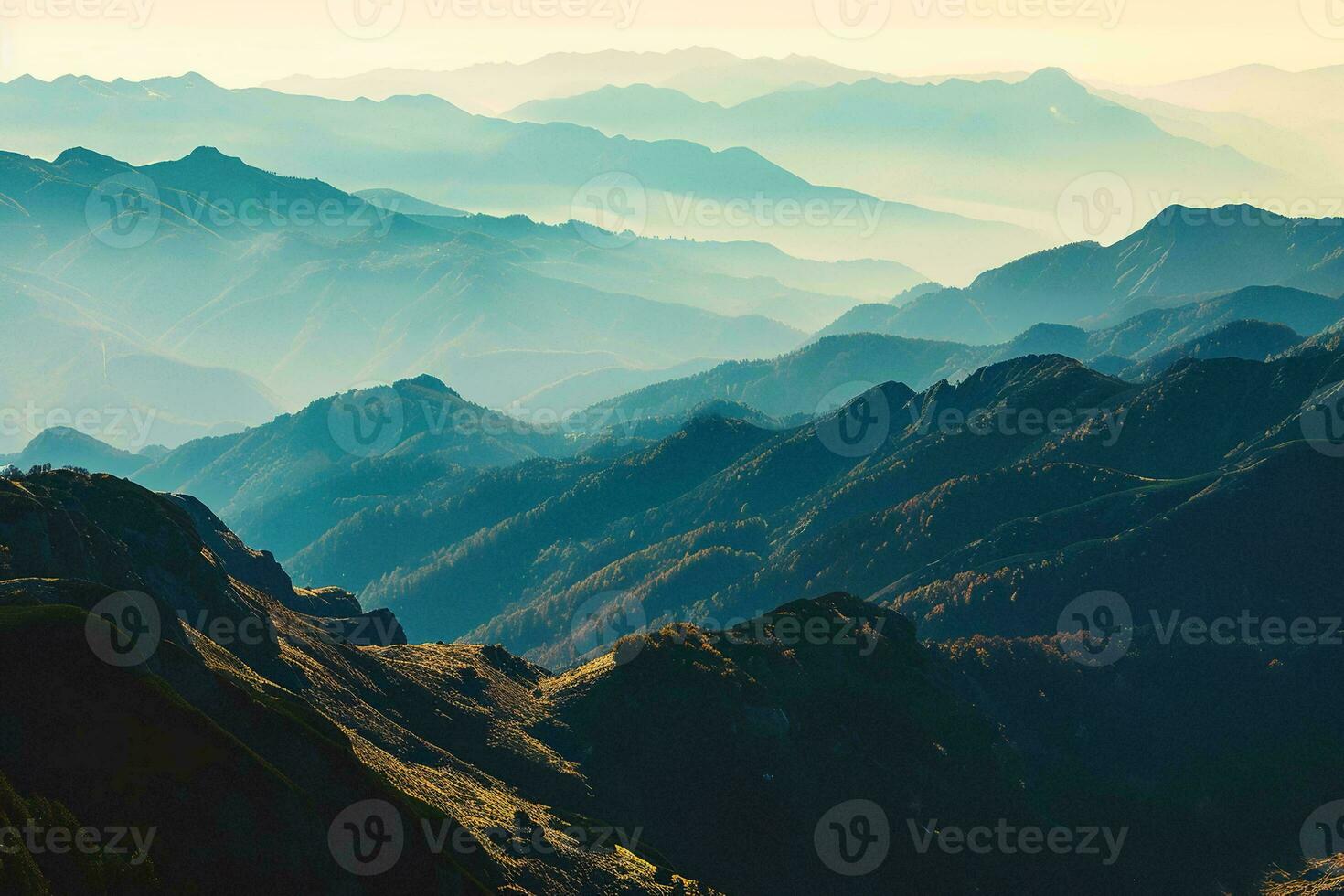 AI generated Sunrise illuminates misty mountains, revealing serene valleys and rugged peaks in this breathtaking landscape. photo