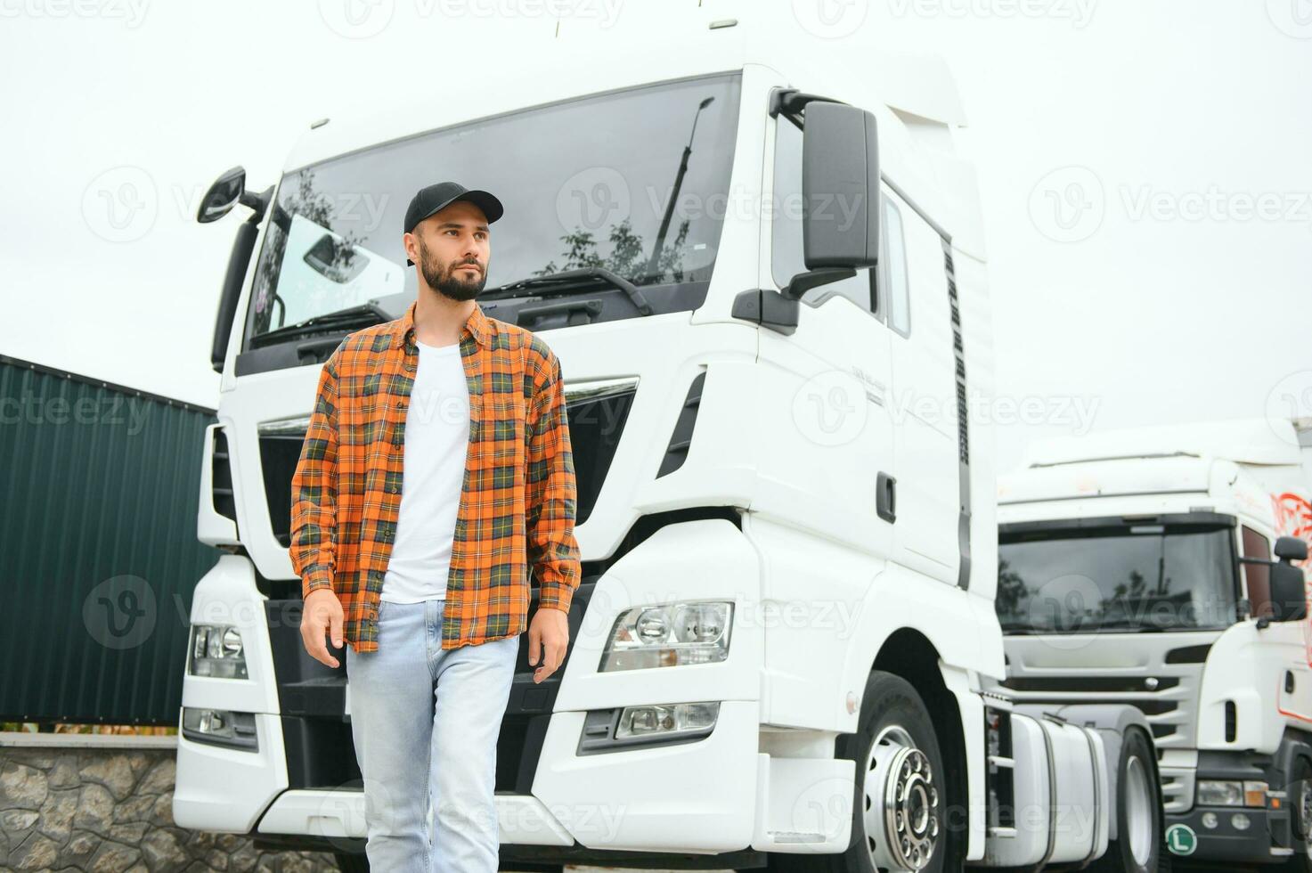 Portrait of confident truck driver on parking lot. Copy space photo