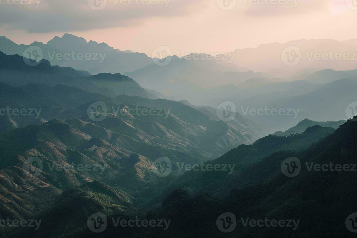 AI generated a tranquil scene of layered mountains veiled in mist, illuminated by the gentle hues of a setting sun, evoking peace. photo