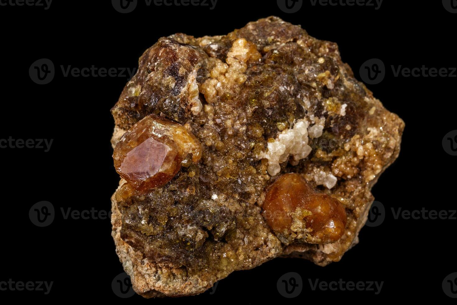 macro mineral stone Grossular, Garnet, Epidote on a black background photo