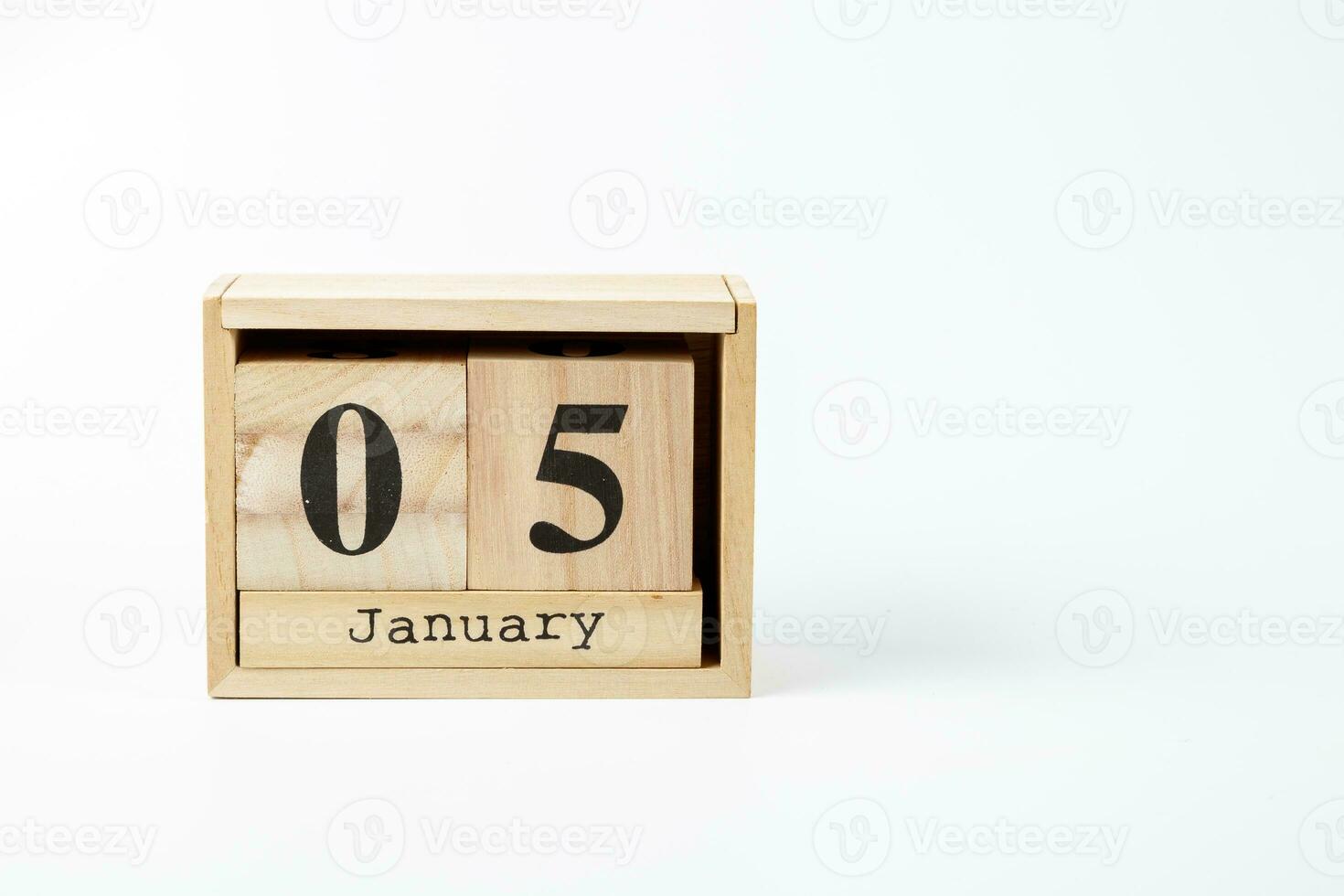 Wooden calendar January 05 on a white background photo