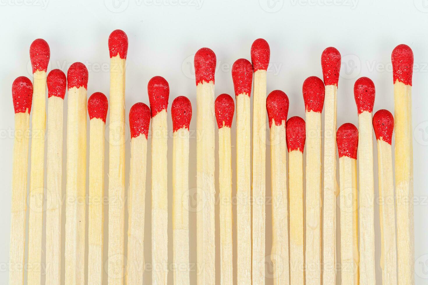 matches with a red head on a white background photo