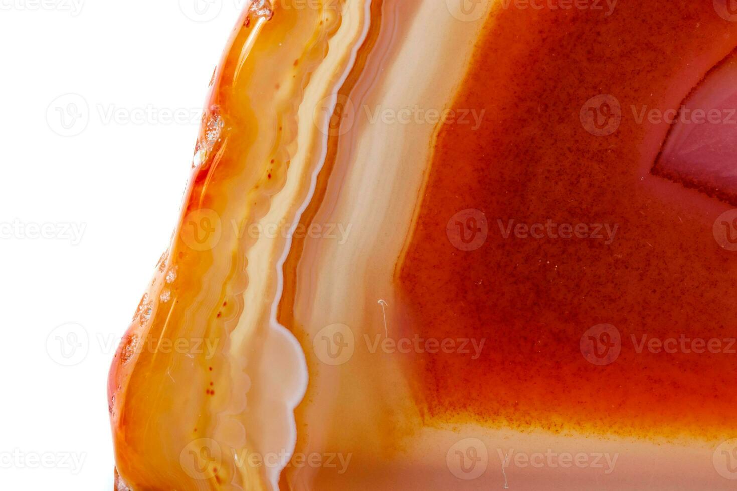 Macro mineral orange agate in crystals on white background photo