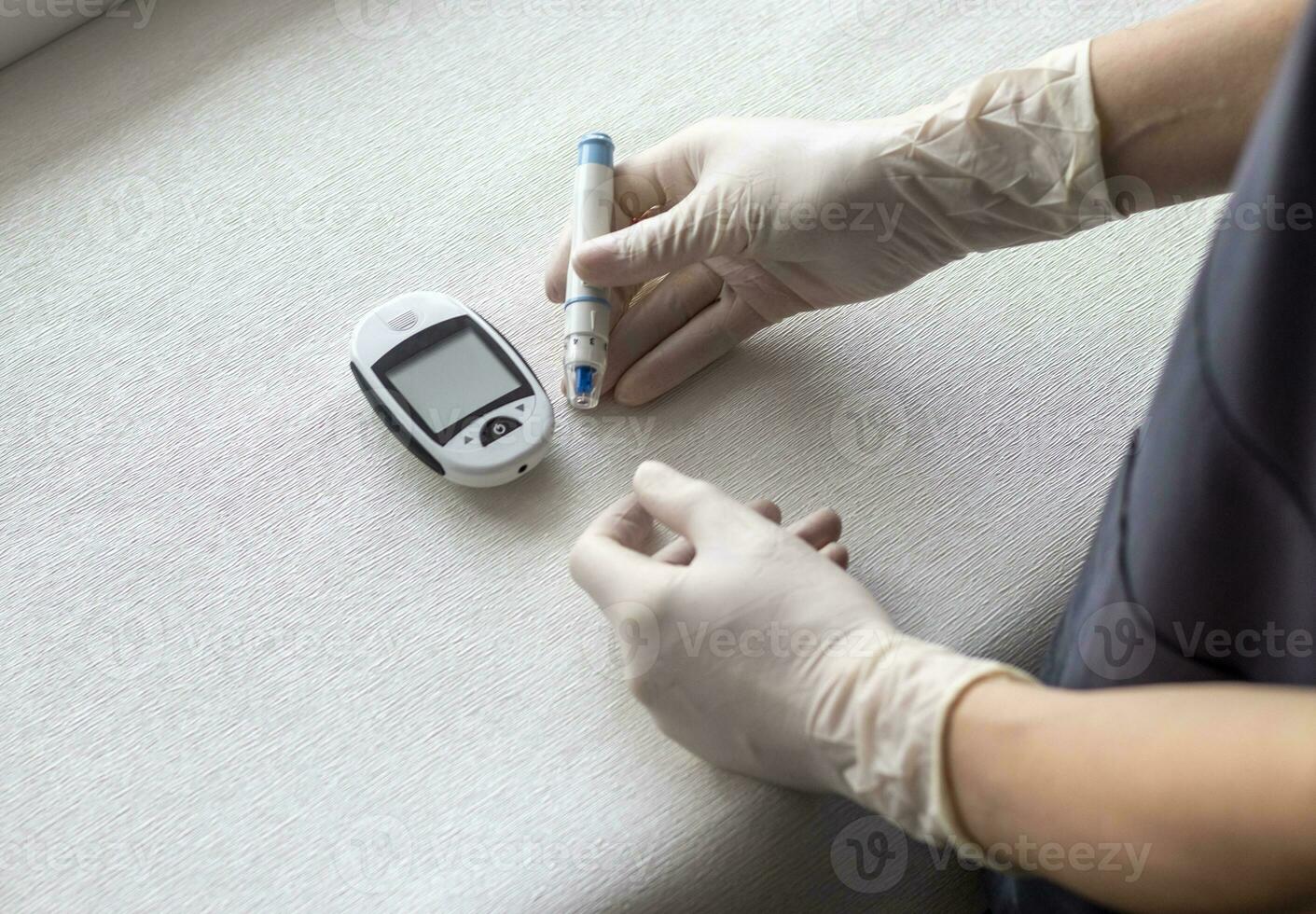 Close up shot of the glucometer instrument on the white surface. Healthcare photo