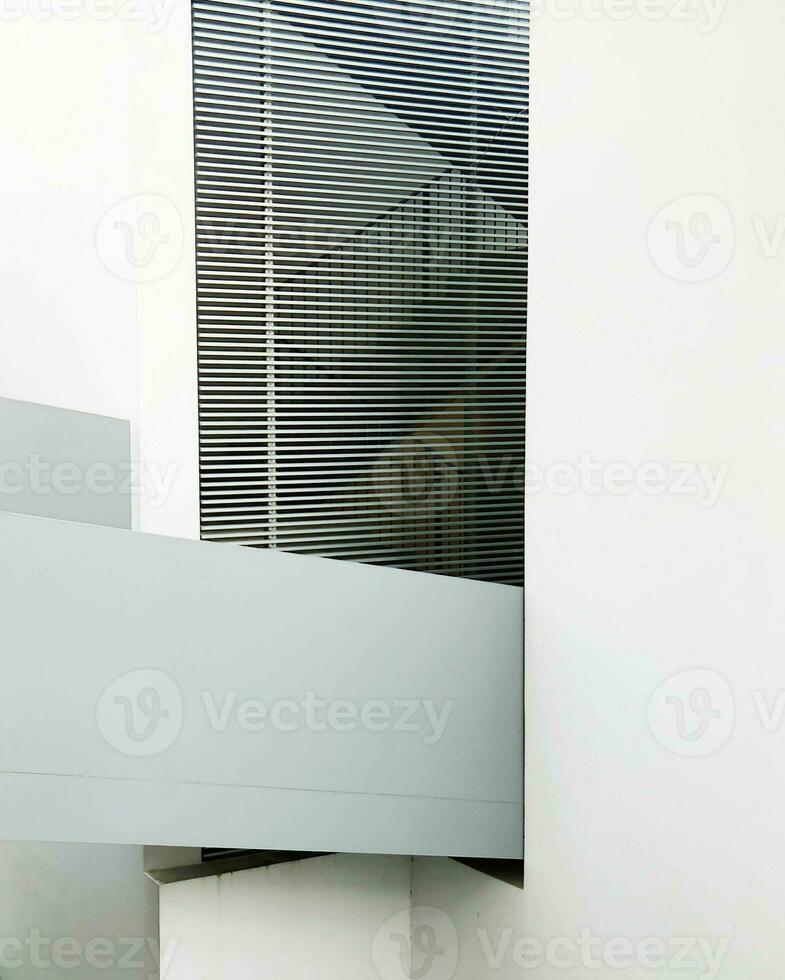 Abstract architectural detail with blinds and partial wall, minimalist design. photo