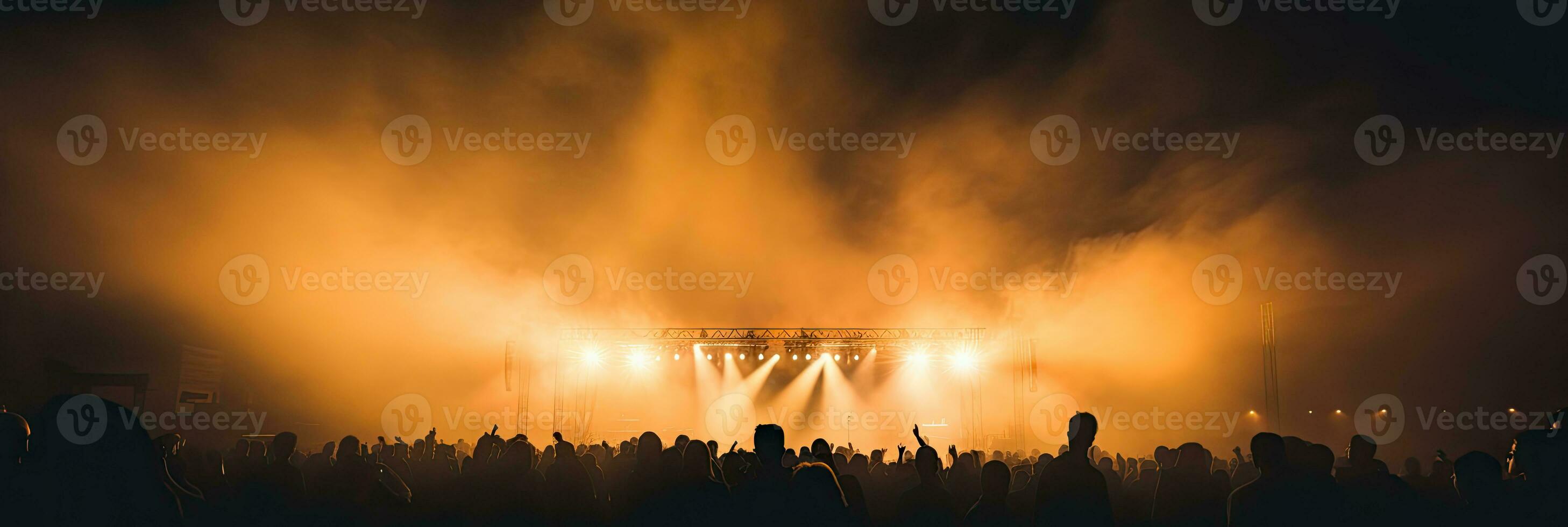 ai generado energético En Vivo música concierto con un multitud de aficionados aplausos y bailando debajo el resplandor de etapa luces. foto