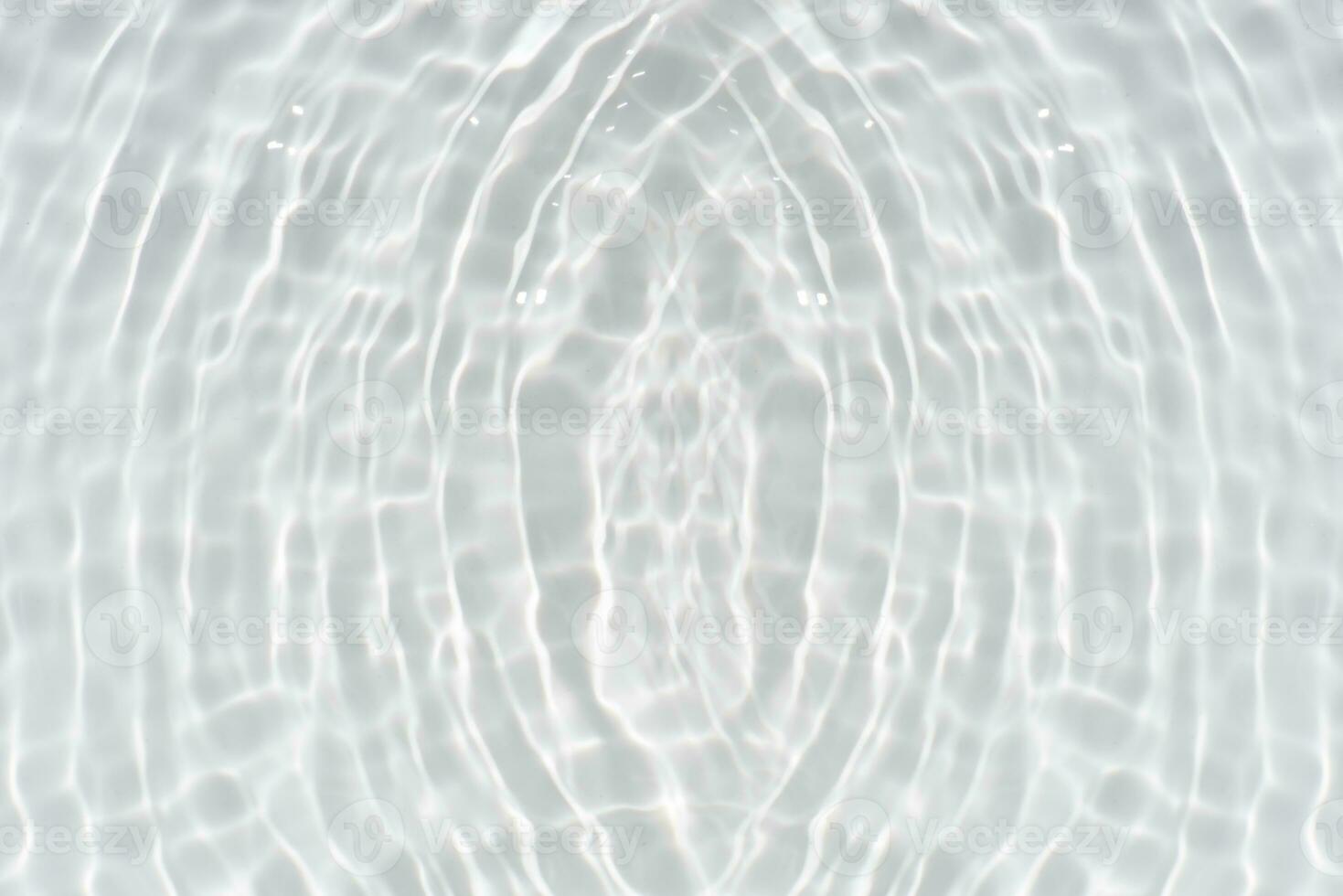 White water with ripples on the surface. Defocus blurred transparent white colored clear calm water surface texture with splashes and bubbles. Water waves with shining pattern texture background. photo