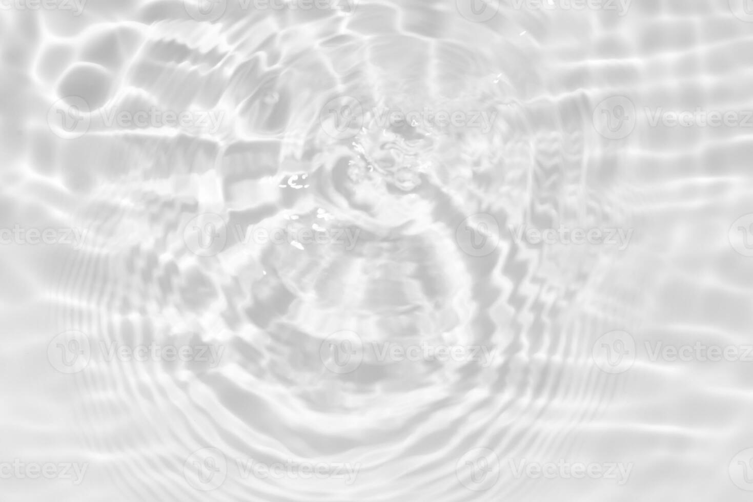 White water with ripples on the surface. Defocus blurred transparent white colored clear calm water surface texture with splashes and bubbles. Water. photo