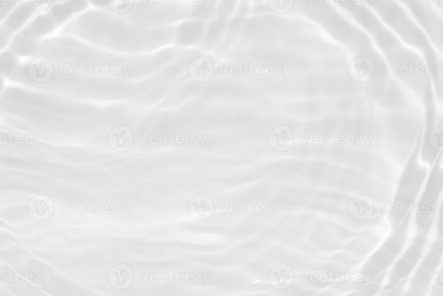 White water with ripples on the surface. Defocus blurred transparent white colored clear calm water surface texture with splashes and bubbles. Water. photo