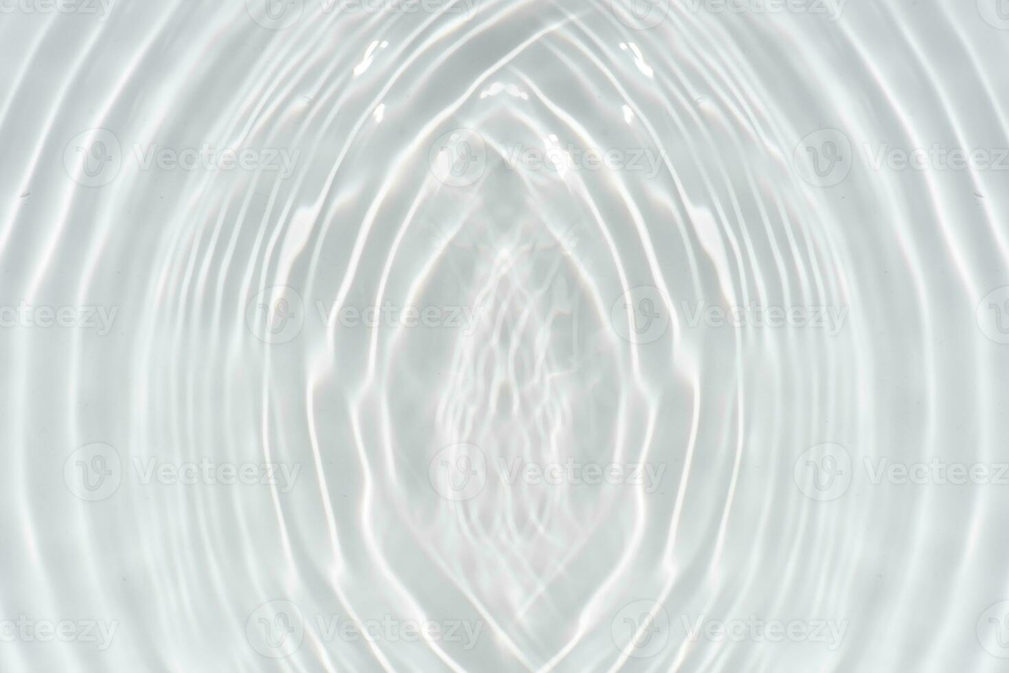 Defocus blurred transparent blue colored clear calm water surface texture with splashes and bubbles. Trendy abstract nature background. Water waves in sunlight with copy space. Blue watercolor shining photo