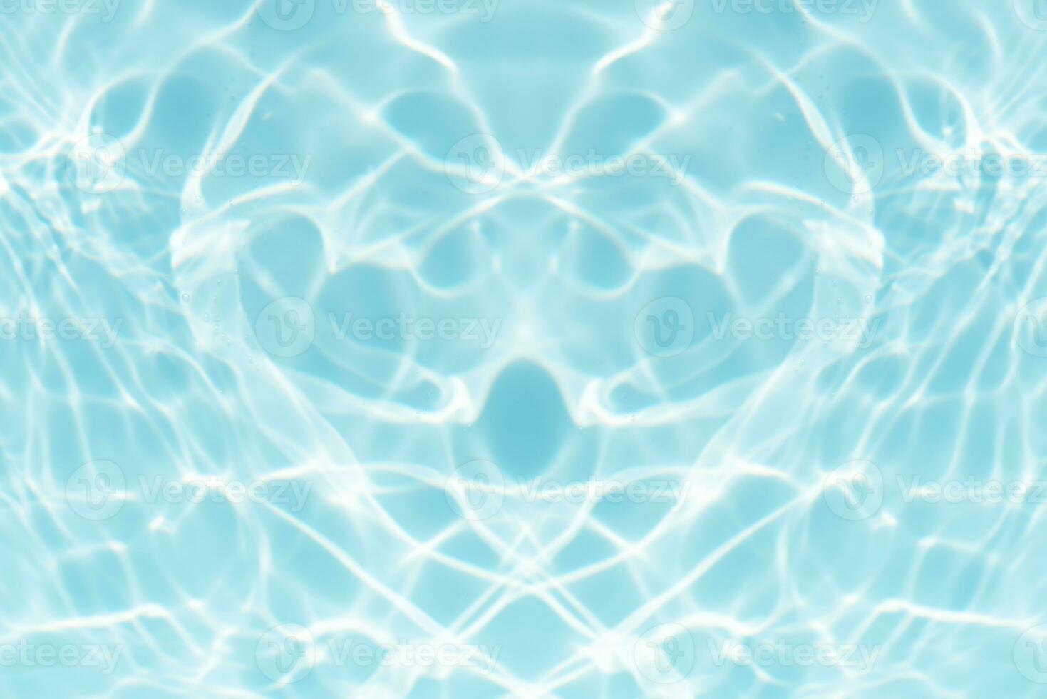 Defocus blurred transparent blue colored clear calm water surface texture with splashes and bubbles. Trendy abstract nature background. Water waves in sunlight with copy space. Blue watercolor shining photo