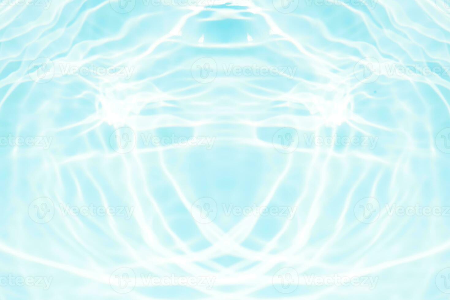 Bluewater waves on the surface ripples blurred. Defocus blurred transparent blue colored clear calm water surface texture with splash and bubbles. Water waves with shining pattern texture background. photo