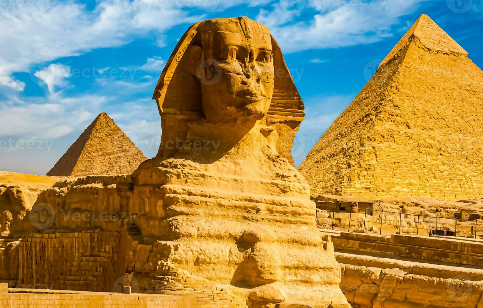 A beautiful picture of the pyramids in Giza in Egypt with the Sphinx photo