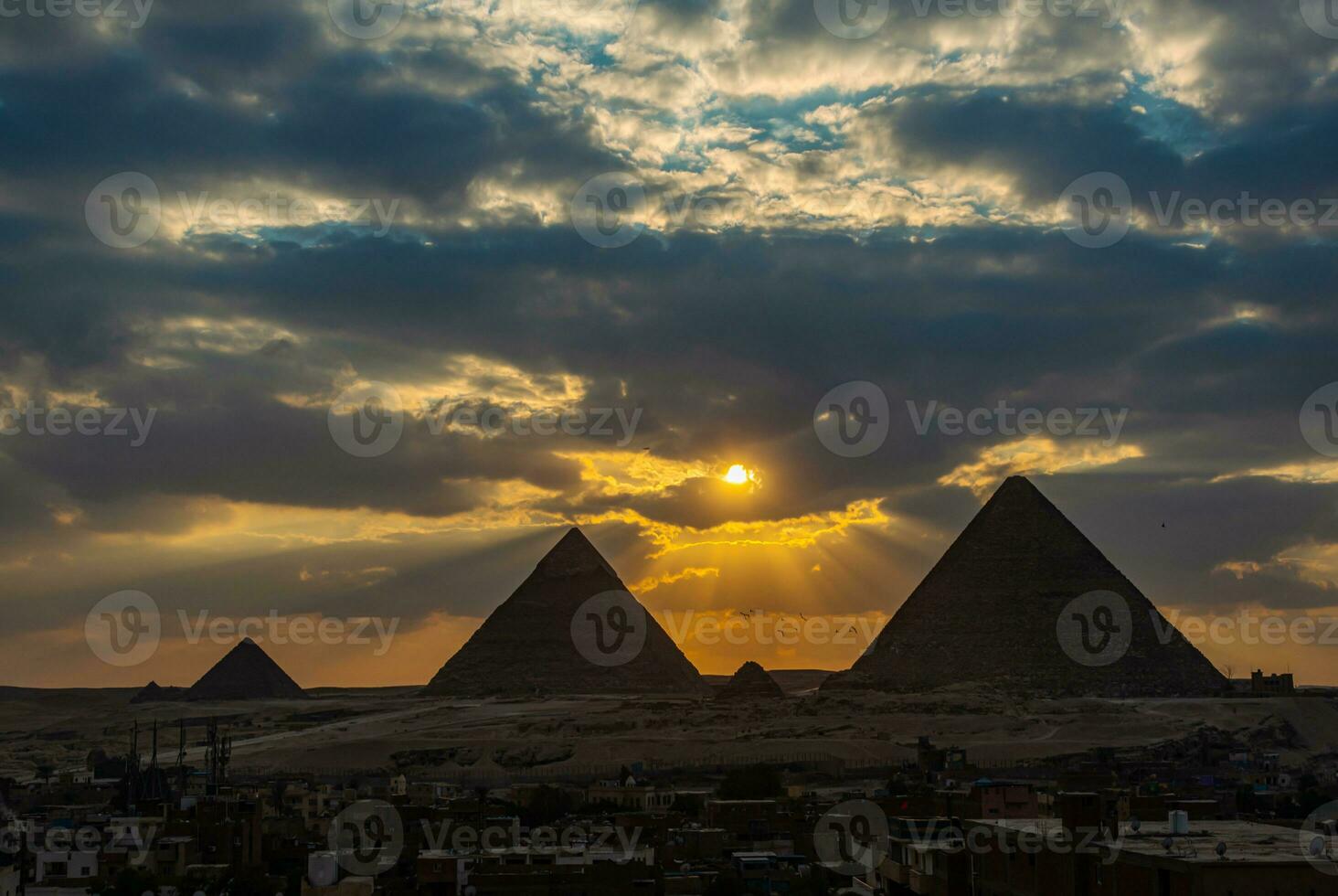 A beautiful picture of the pyramids in Giza, Egypt at sunset photo