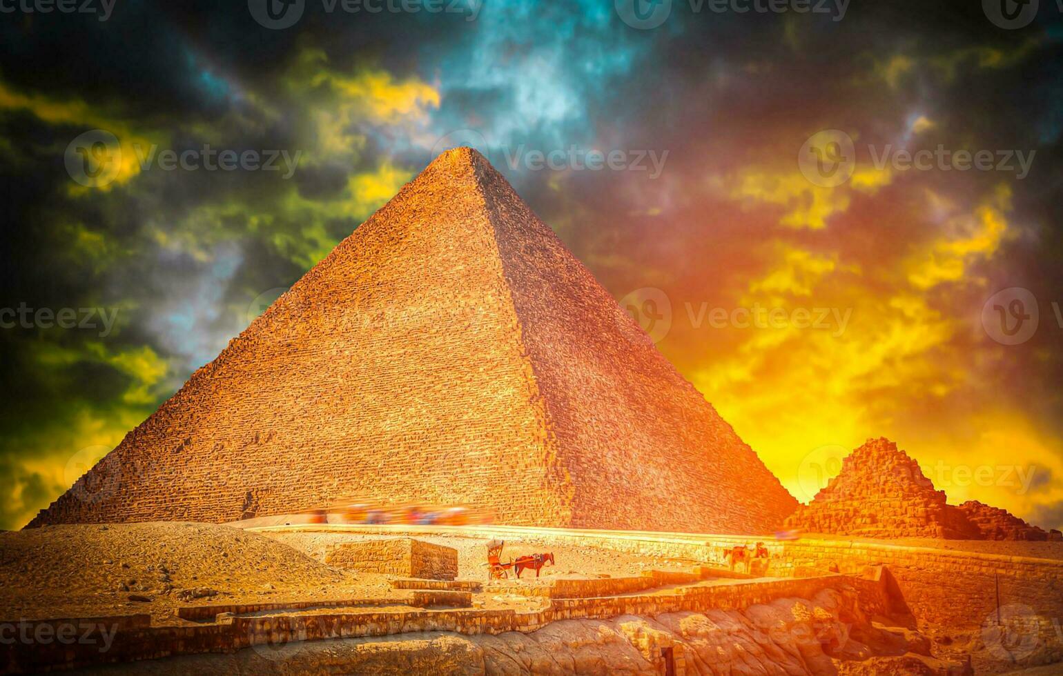 A beautiful picture of the pyramids in Giza, Egypt at sunset photo