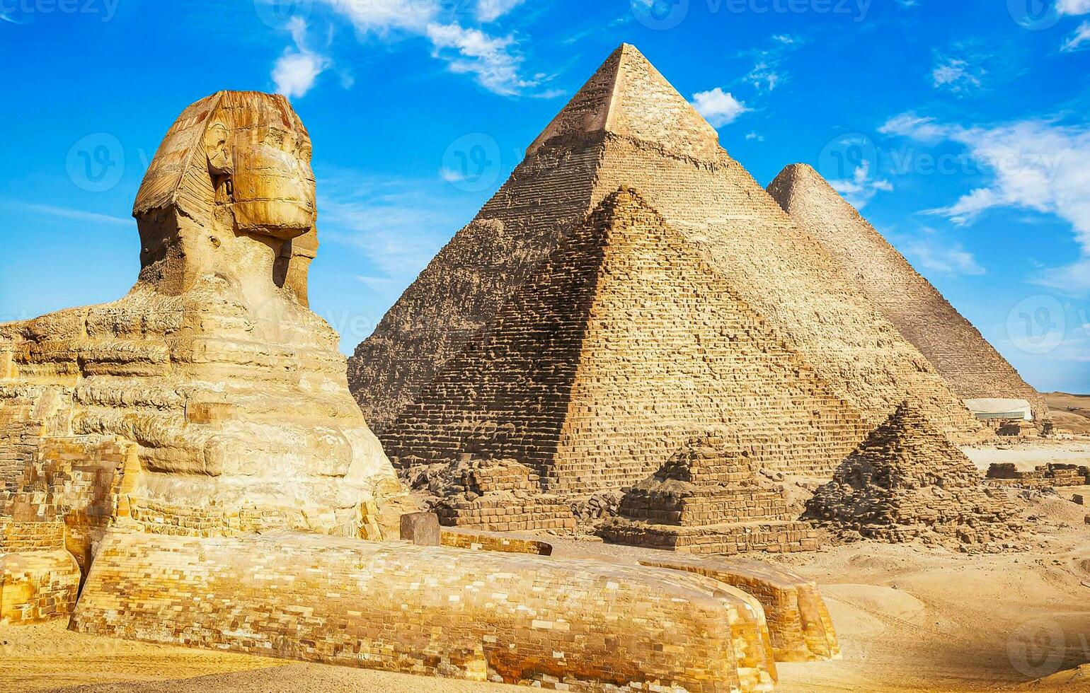 A beautiful picture of the pyramids in Giza in Egypt with the Sphinx photo