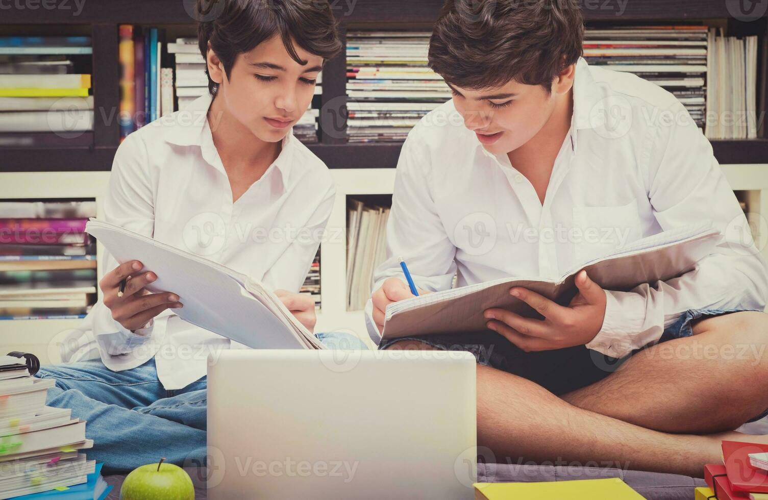 Two schoolboys in the library photo