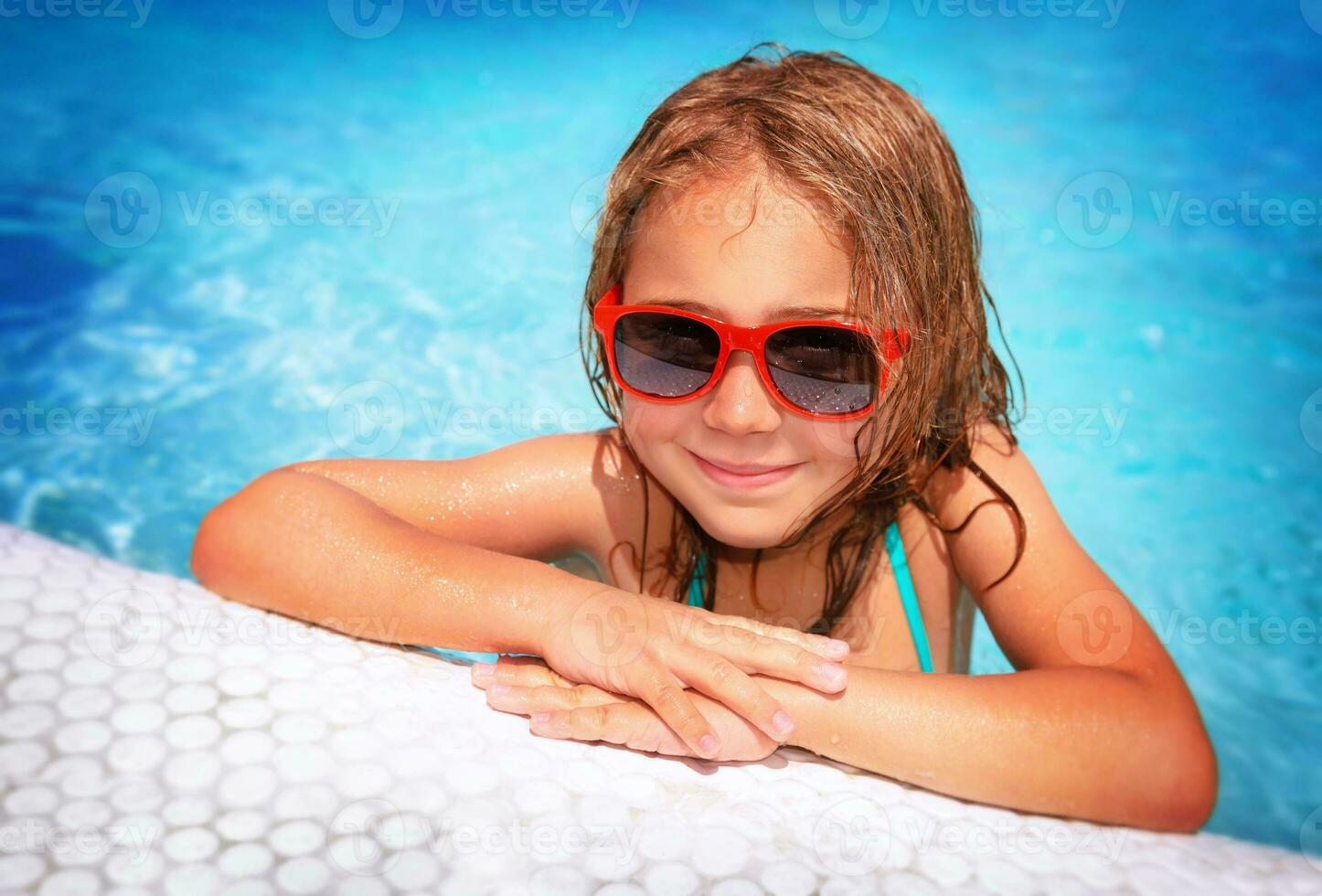 Little girl in swimming pool photo
