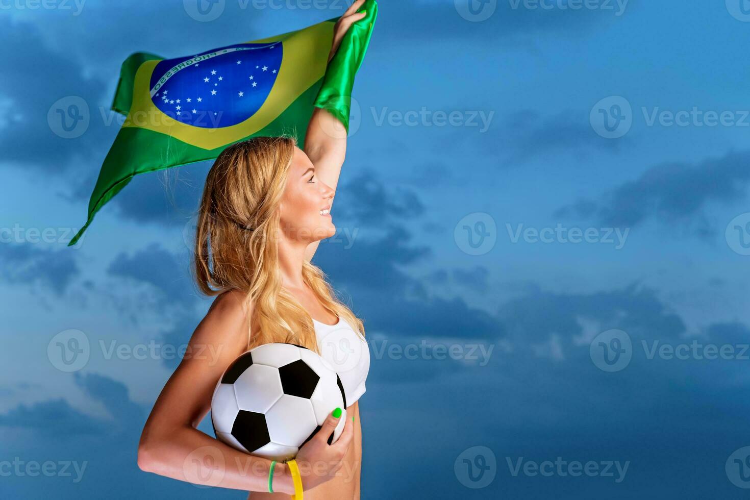 Happy fan of Brazilian football team photo