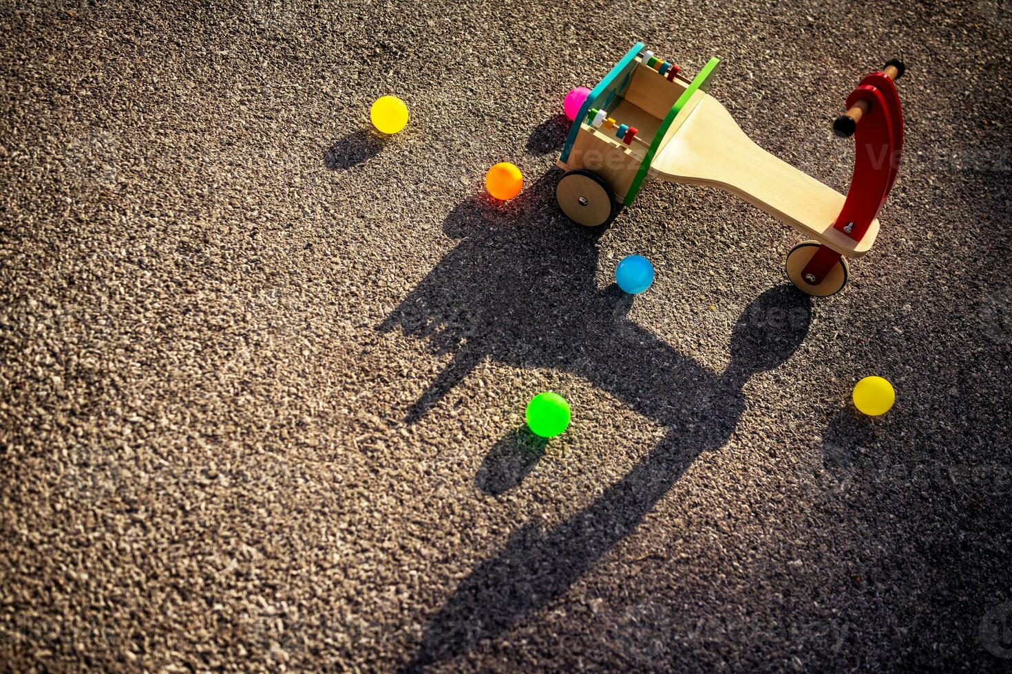 Wooden childish bicycle on playground photo