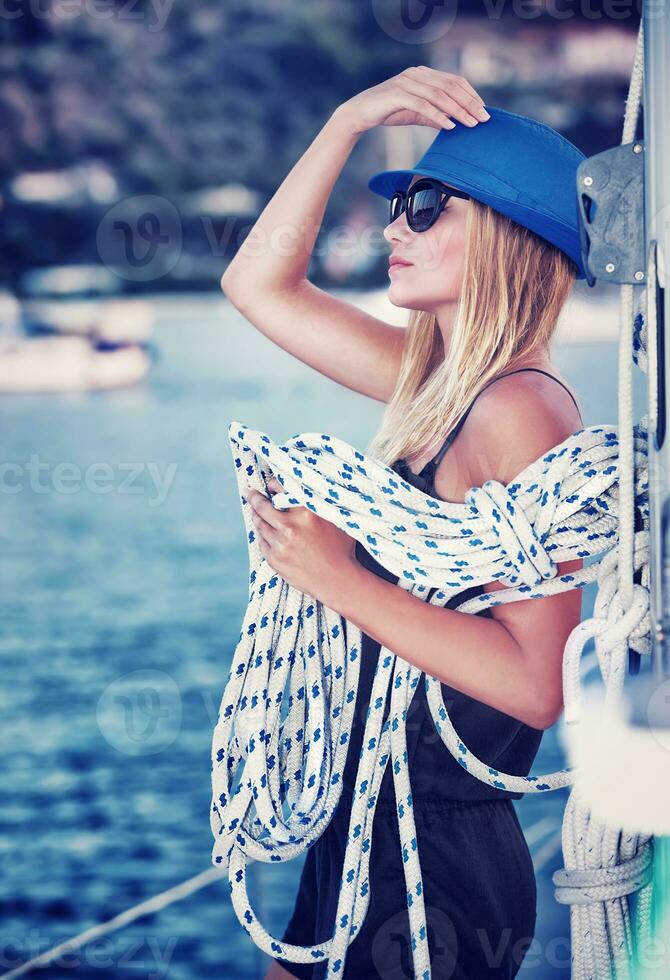 Sexy girl on sailboat photo