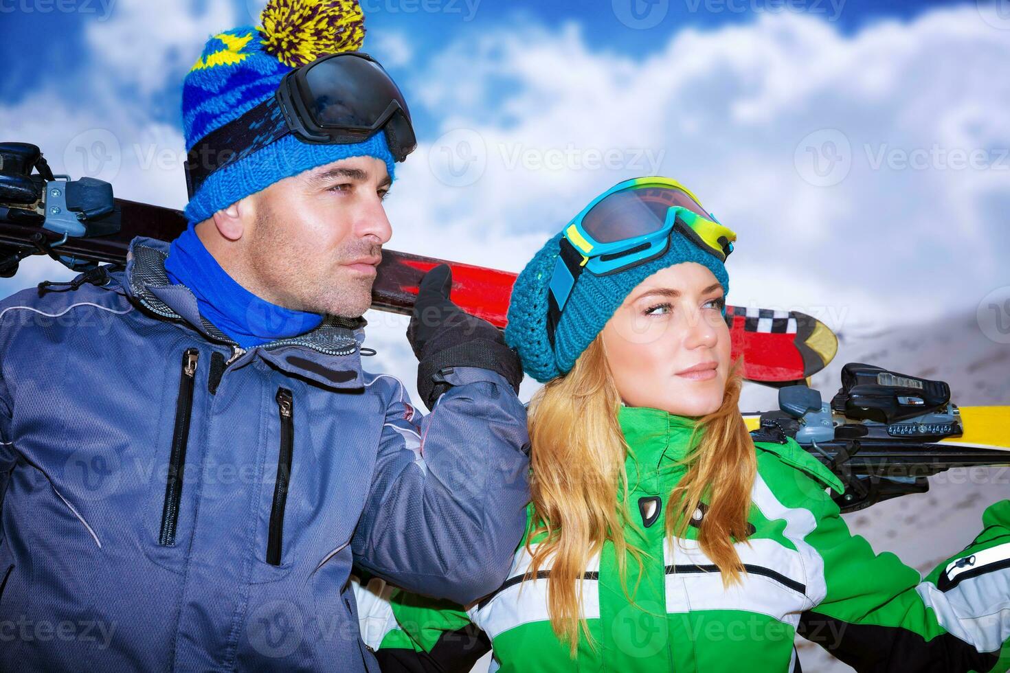 Portrait of a nice couple playing winter sports photo